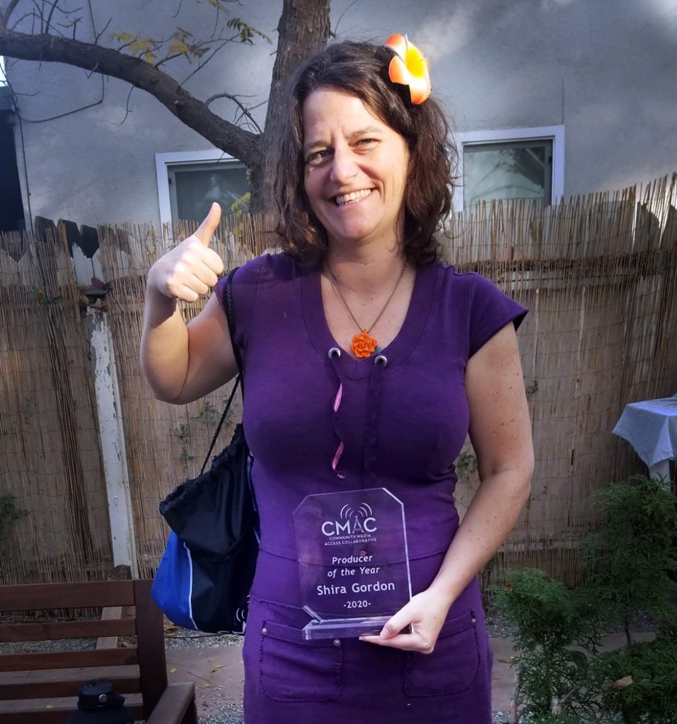 Shira D Gordon holding an award